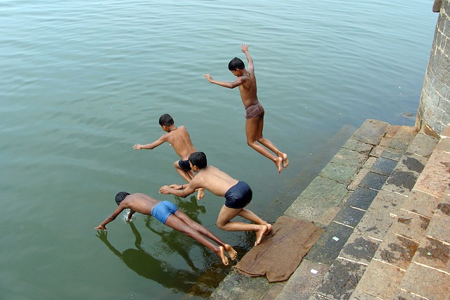 Boys Diving in River