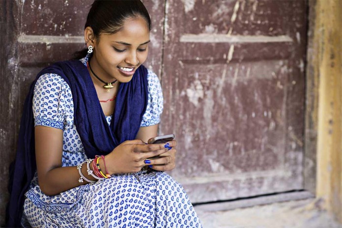 Woman Typing On Smartphone