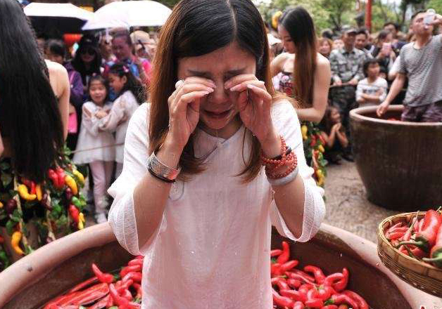 Woman Eating Chillies