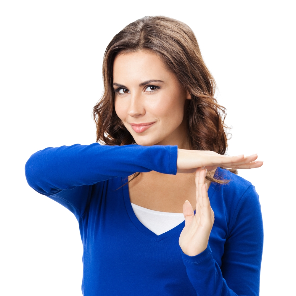 Woman showing heart symbol gesture, isolated