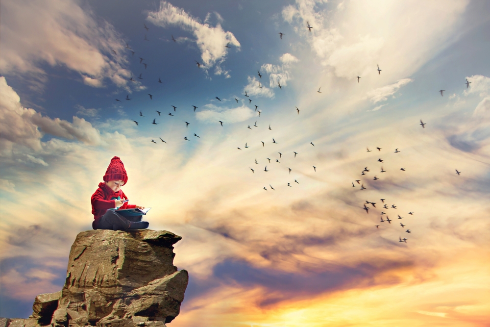 Boy, sitting on a rock in the sky, birds flying around him