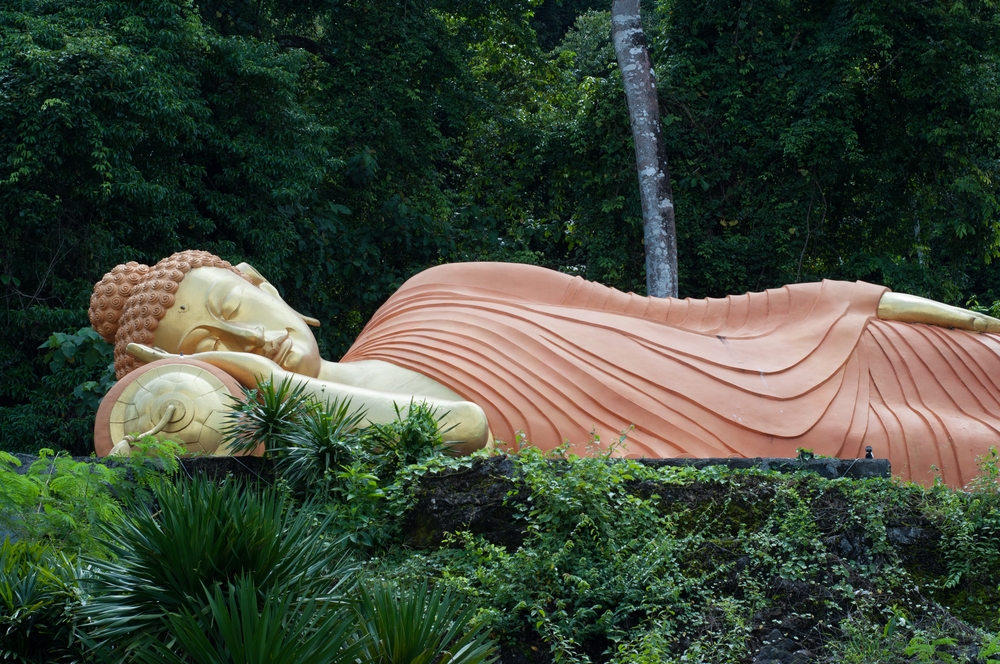 sleeping buddha statue at krabi, thailand