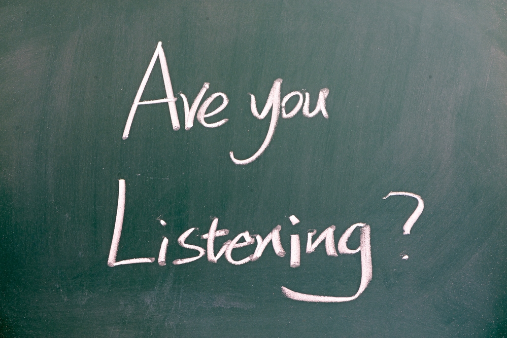 “Are you listening” written on blackboard
