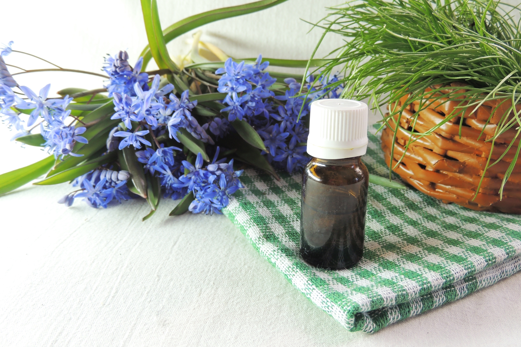 Essential oil and spring flowers
