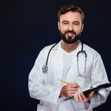 Portrait of a friendly male doctor dressed in uniform